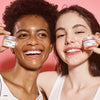 Load image into Gallery viewer, cosrx lip sleep mask two girls having fun with a lip mask for in the night that wil soothes cracked and dry lip and makes the lips plump again available at the skin counter